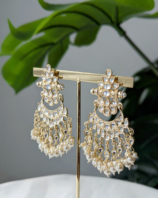 Traditional Kundan earrings featuring intricate stonework, pearl accents ideal for festive and wedding wear. Imitation jewelry. Pick-up in Ajax Ontario. Worldwide shipping available. Perfect for weddings, festival jewelry, indian Jewelry, kids jewelry, kundan jewelry, gifting, costume jewelry, fashion jewelry, Eid, onam, Diwali, karwachauth, navratri. Free shipping available. Jewelry for women. Indian jewelry in ajax durham toronto