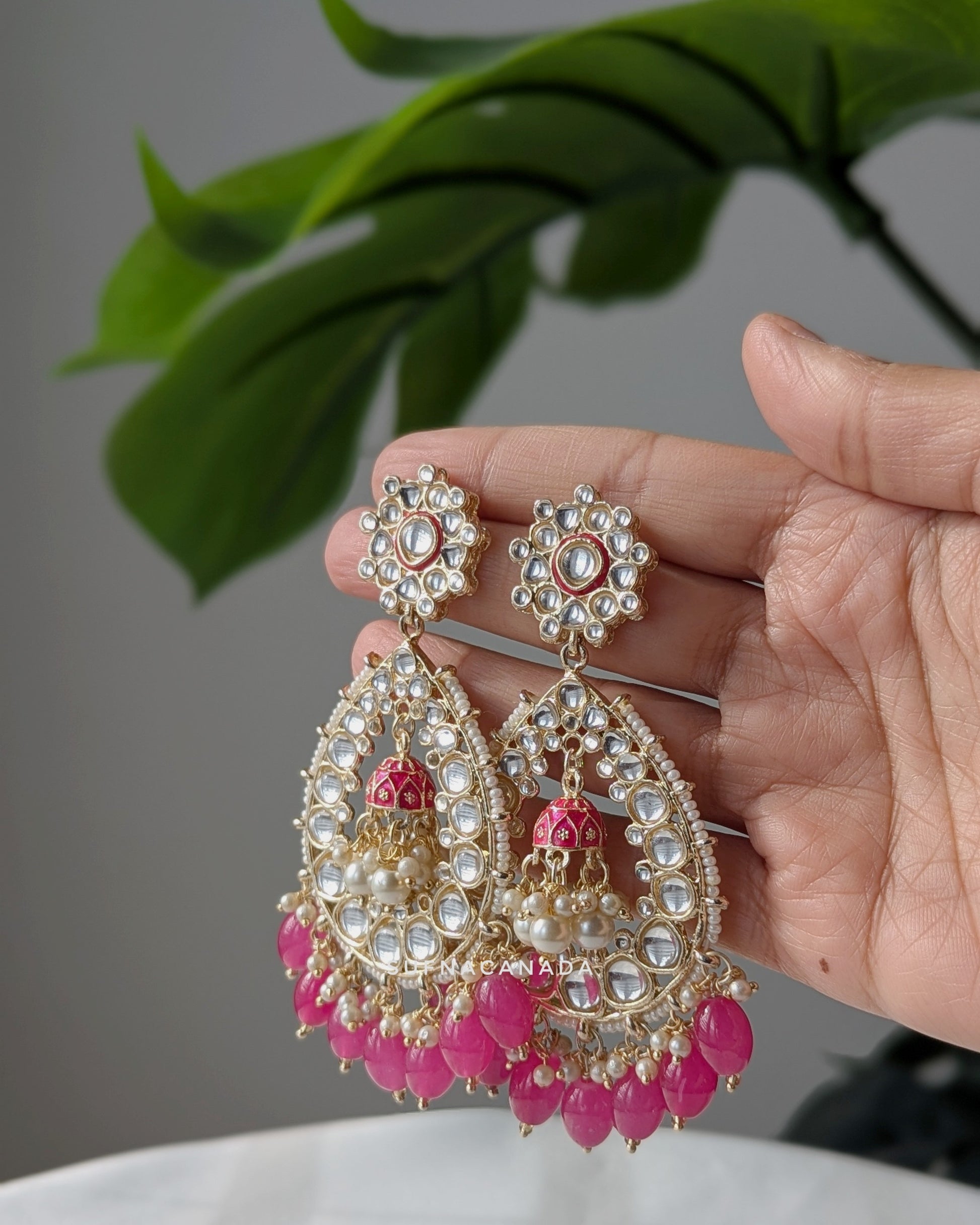 Traditional Indian chandbali earrings with intricate kundan work, pearl accents, and pink bead drops, designed by Sufna Canada. Imitation jewelry. Pick-up in Ajax Ontario. Worldwide shipping available. Perfect for weddings, festival jewelry, indian Jewelry, kids jewelry, kundan jewelry, gifting, costume jewelry, fashion jewelry, Eid, onam, Diwali, karwachauth, navratri. Free shipping available. Jewelry for women. Indian jewelry in ajax durham toronto