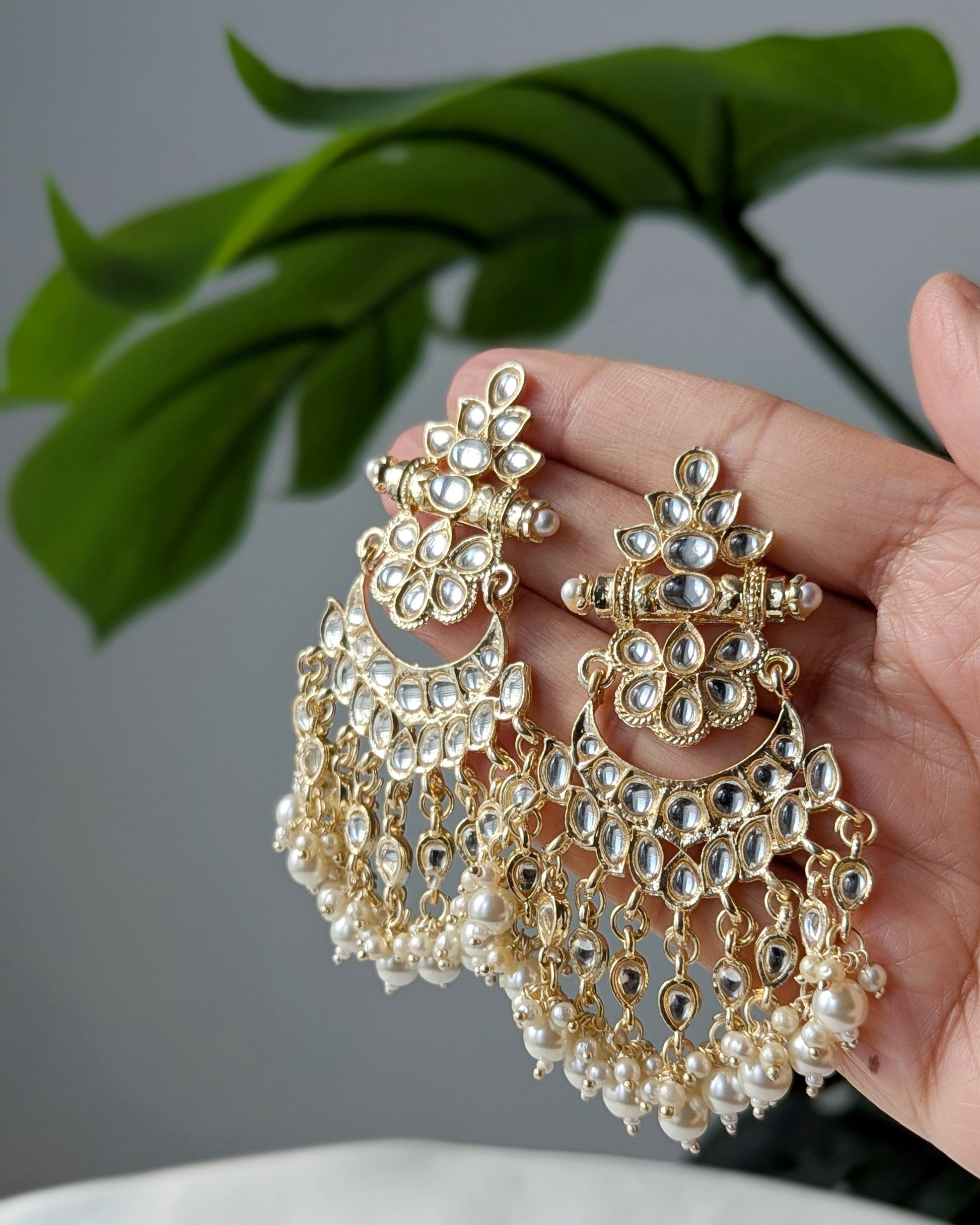 Traditional Kundan earrings featuring intricate stonework, pearl accents ideal for festive and wedding wear. Imitation jewelry. Pick-up in Ajax Ontario. Worldwide shipping available. Perfect for weddings, festival jewelry, indian Jewelry, kids jewelry, kundan jewelry, gifting, costume jewelry, fashion jewelry, Eid, onam, Diwali, karwachauth, navratri. Free shipping available. Jewelry for women. Indian jewelry in ajax durham toronto.