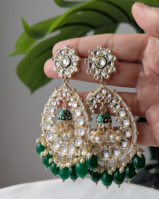 Traditional Indian chandbali earrings with intricate kundan work, pearl accents, and green bead drops, designed by Sufna Canada. Imitation jewelry. Pick-up in Ajax Ontario. Worldwide shipping available. Perfect for weddings, festival jewelry, indian Jewelry, kids jewelry, kundan jewelry, gifting, costume jewelry, fashion jewelry, Eid, onam, Diwali, karwachauth, navratri. Free shipping available. Jewelry for women. Indian jewelry in ajax Ontario