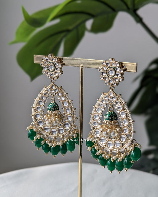 Traditional Indian chandbali earrings with intricate kundan work, pearl accents, and green bead drops, designed by Sufna Canada. Imitation jewelry. Pick-up in Ajax Ontario. Worldwide shipping available. Perfect for weddings, festival jewelry, indian Jewelry, kids jewelry, kundan jewelry, gifting, costume jewelry, fashion jewelry, Eid, onam, Diwali, karwachauth, navratri. Free shipping available. Jewelry for women. Indian jewelry in ajax ON toronto