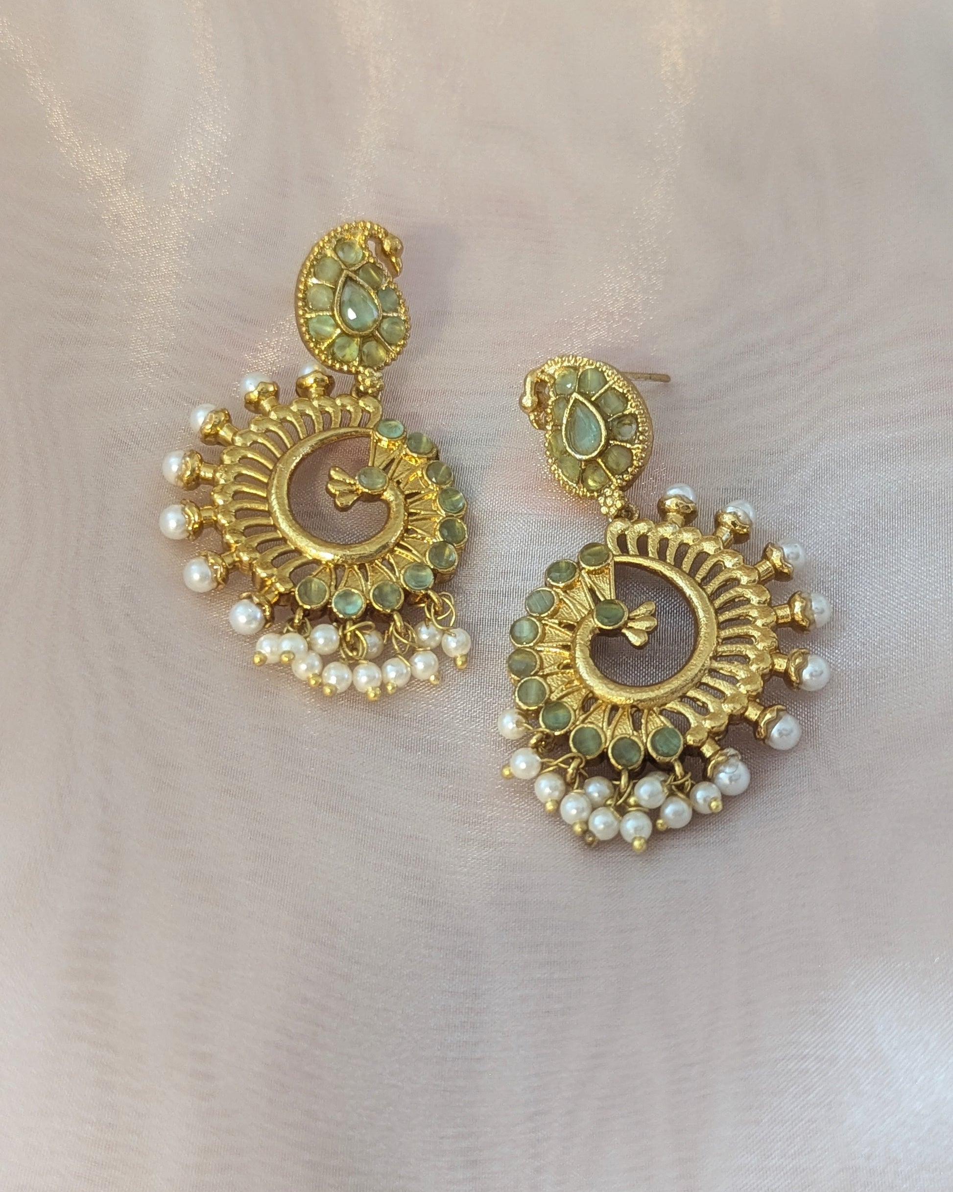Gold earrings with pearls and green stone accents. Pick-up in Ajax Ontario. Worldwide shipping available. Perfect for wedding, festival jewelry, indian Jewelry, kids jewelry, kundan jewelry, gifting, costume jewelry, fashion jewelry, Eid, onam, Diwali, karwachauth, navratri. Free shipping available. Jewelry for women. Indian jewelry in ajax durham region.