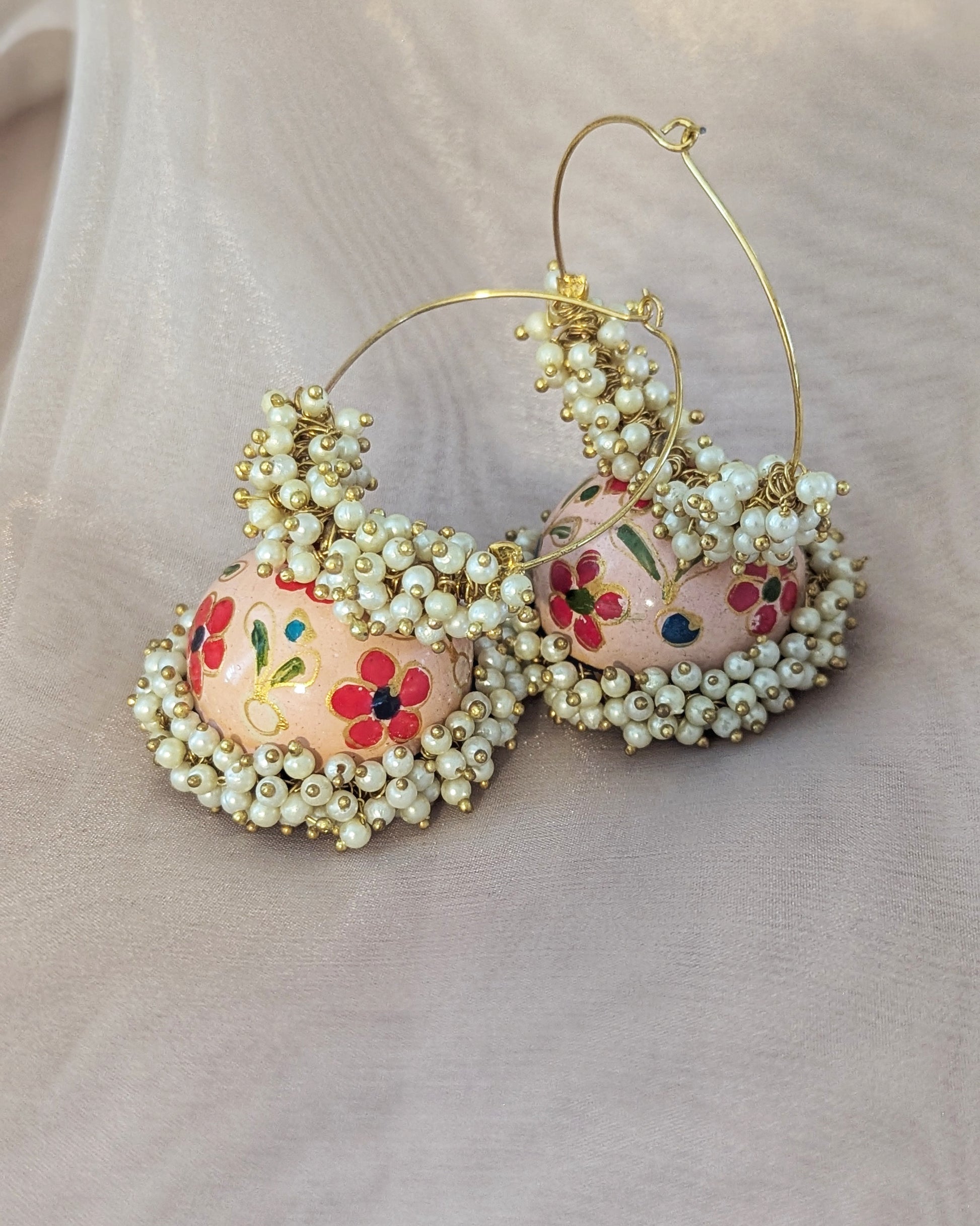 Hand painted meenakari jhumkis with golden hoop and dainty pearl detailing. Pick-up in Ajax Ontario. Worldwide shipping available. Perfect for wedding, festival jewelry, indian Jewelry, kids jewelry, kundan jewelry, gifting, costume jewelry, fashion jewelry, Eid, onam, Diwali, karwachauth, navratri. Free shipping available. Jewelry for women. Indian jewelry in ajax durham region. Bollywood style jewelry.