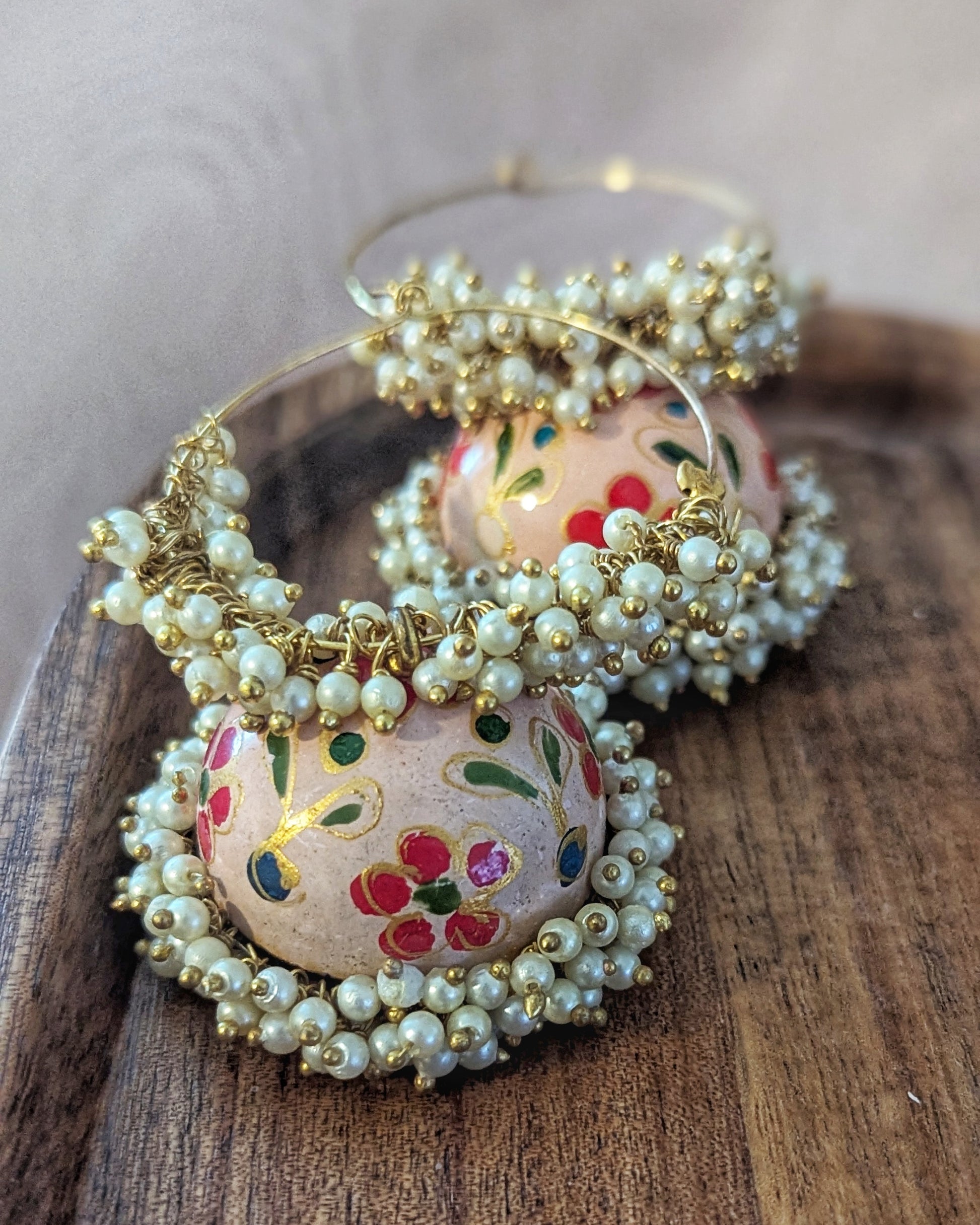 Hand painted meenakari jhumkis with golden hoop and dainty pearl detailing. Pick-up in Ajax Ontario. Worldwide shipping available. Perfect for wedding, festival jewelry, indian Jewelry, kids jewelry, kundan jewelry, gifting, costume jewelry, fashion jewelry, Eid, onam, Diwali, karwachauth, navratri. Free shipping available. Jewelry for women. Indian jewelry in ajax durham region. Bollywood style jewelry.
