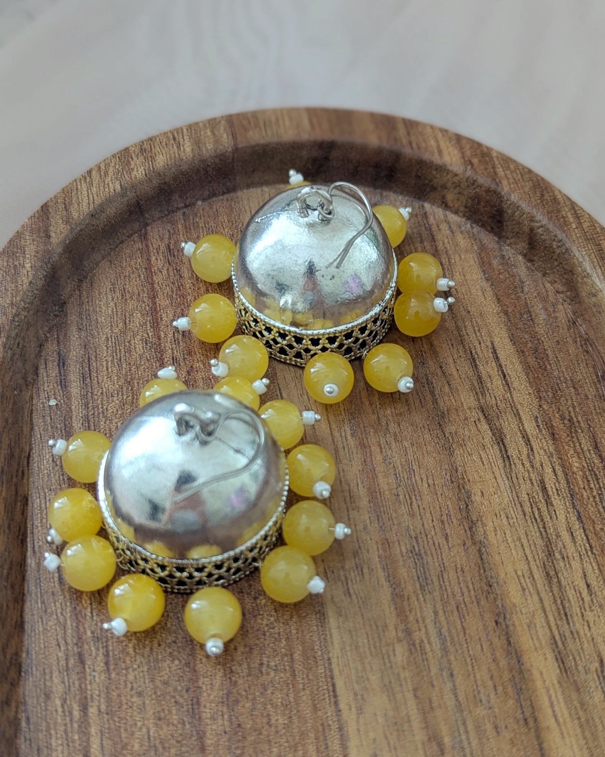 Oxidized Silver jhumkas with bright yellow beads. Pick-up in Ajax Ontario. Worldwide shipping available. Perfect for wedding, festival jewelry, indian Jewelry, kids jewelry, kundan jewelry, gifting, costume jewelry, fashion jewelry, Eid, onam, Diwali, karwachauth, navratri. Free shipping available. Jewelry for women. Indian jewelry in ajax durham region. Bollywood style jewelry.