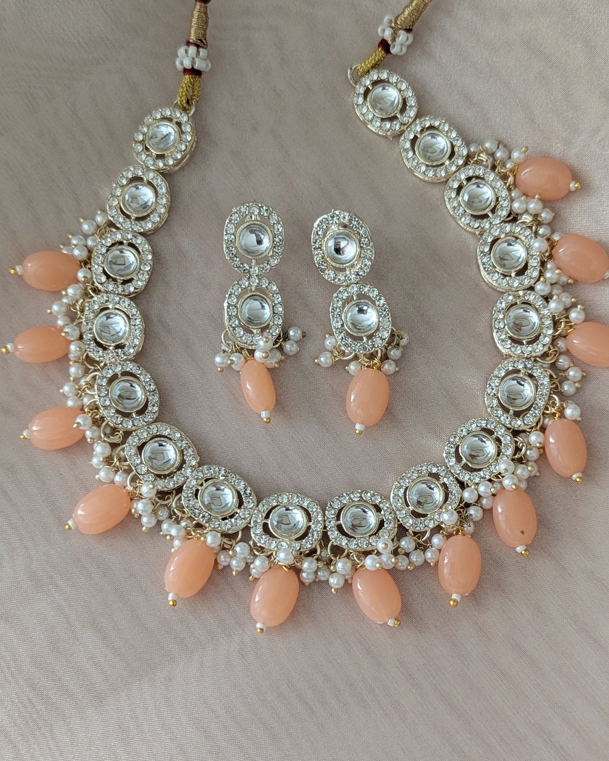 Dainty kundan necklace with peach color beads. Comes with matching drop earrings. Pick-up in Ajax Ontario. Worldwide shipping available. Perfect for wedding, festival jewelry, indian Jewelry, kids jewelry, kundan jewelry, gifting, costume jewelry, fashion jewelry, Eid, onam, Diwali, karwachauth, navratri. Free shipping available. Jewelry for women.