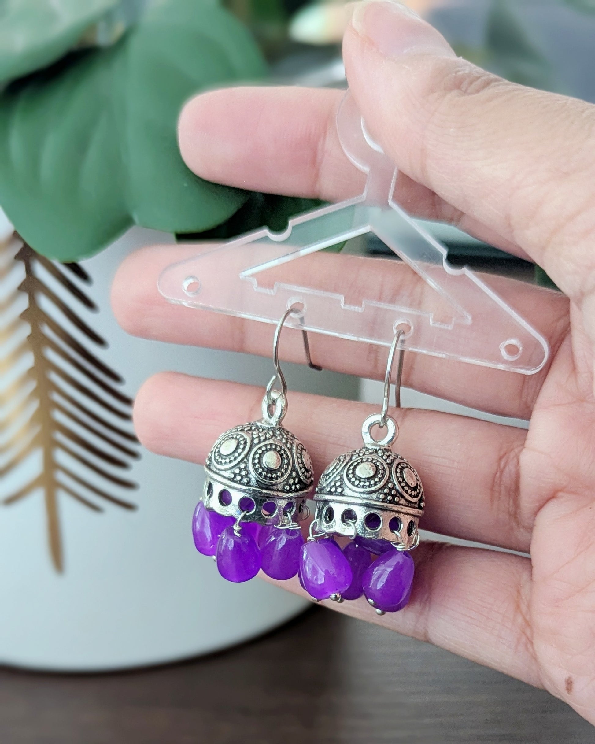Small cute purple jhumkis in Oxidized Silver. Perfect to match with any outfit or wear it as a contrast to a different color. Available for pick-up in Ajax, Ontario with worldwide shipping available. Pick-up in Ajax Ontario. Worldwide shipping available. Perfect for wedding, festival jewelry, indian Jewelry, kids jewelry, kundan jewelry, gifting, costume jewelry, fashion jewelry, Eid, onam, Diwali, karwachauth, navratri. Free shippi