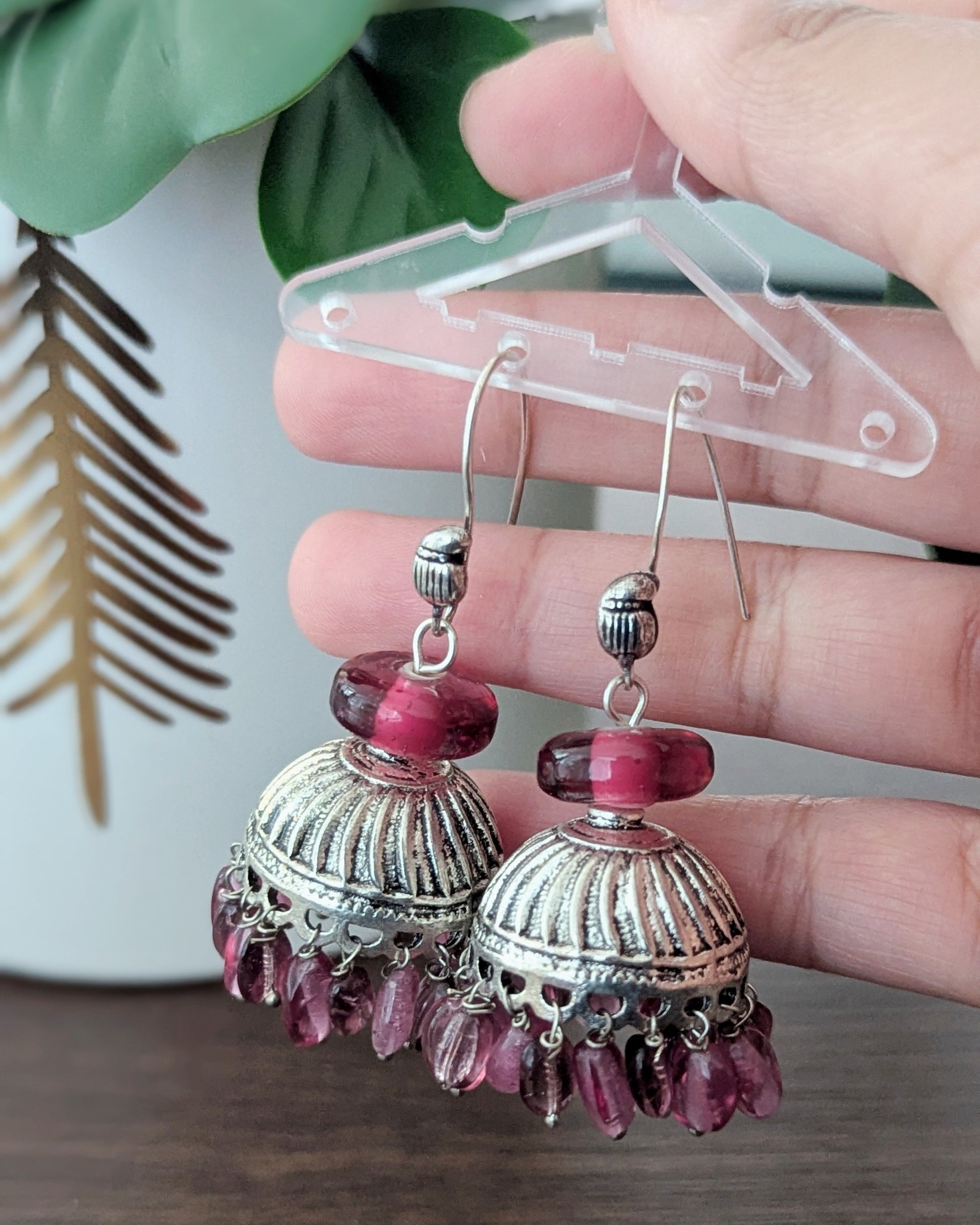 Casual earrings in Oxidized Silver with onion pink/maroon color beads. Perfect to match with any outfit or wear it as a contrast to a different color. Available for pick-up in Ajax, Ontario with worldwide shipping available. Pick-up in Ajax Ontario. Worldwide shipping available. Perfect for wedding, festival jewelry, indian Jewelry, kids jewelry, kundan jewelry, gifting, costume jewelry, fashion jewelry, Eid, onam, Diwali, karwachauth, navratri. Free shipping over $50.