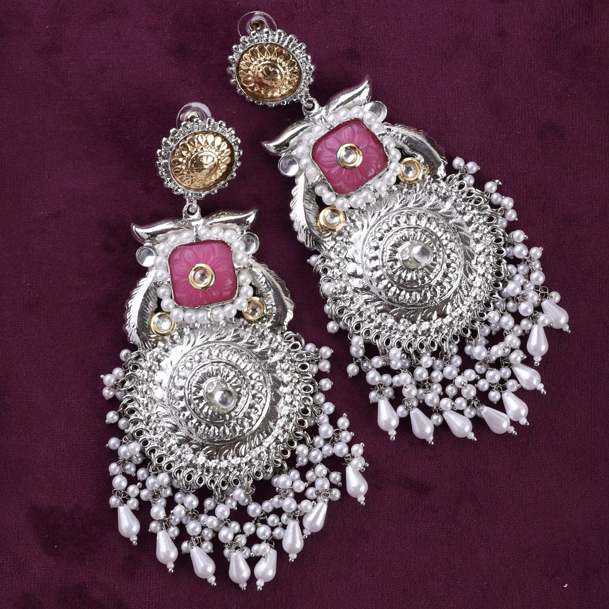 A pair of silver-colored chandbali earrings with dual-tone pink and white embellishments. Pick-up in Ajax Ontario. Worldwide shipping available. Perfect for wedding, festival jewelry, indian Jewelry, kids jewelry, kundan jewelry, gifting, costume jewelry, fashion jewelry, Eid, onam, Diwali, karwachauth, navratri. Free shipping available. Jewelry for women. Indian jewelry in ajax durham region.