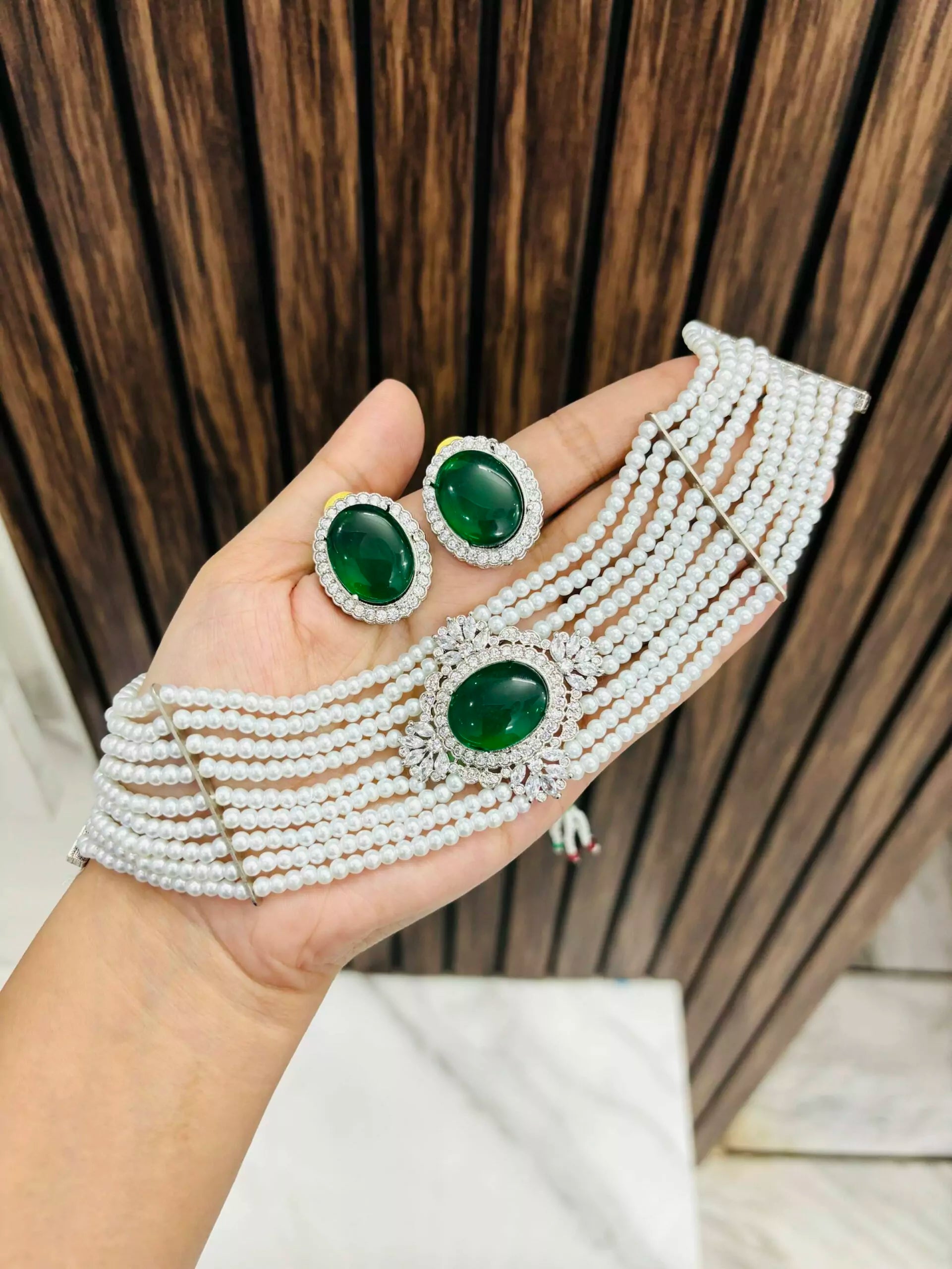 Bollywood inspired choker in white pearls and green stone in the middle. Comes with matching earrings.  Great to pair with suits, sarees and western outfits. Available at Sufna Canada in Ajax, Durham Toronto GTA Ontario, worldwide shipping.