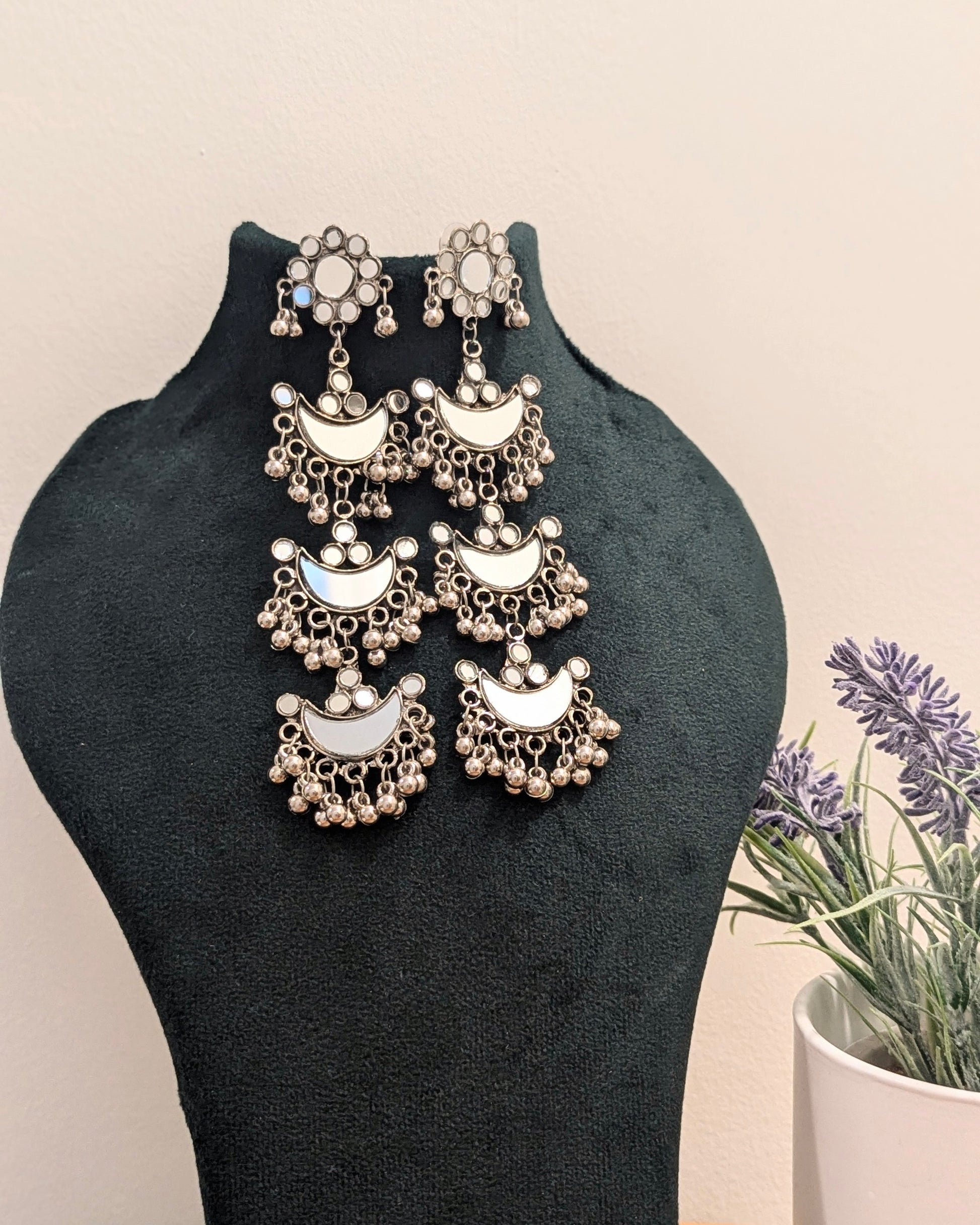 long dangler earrings in oxidized silver with statement mirror design. Pick-up in Ajax Ontario. Worldwide shipping available. Perfect for wedding, festival jewelry, indian Jewelry, kids jewelry, kundan jewelry, gifting, costume jewelry, fashion jewelry, Eid, Diwali, karwachauth, navratri. Free shipping available. Jewelry for women.