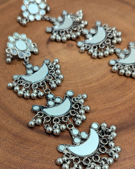 long dangler earrings in oxidized silver with statement mirror design. Pick-up in Ajax Ontario. Worldwide shipping available. Perfect for wedding, festival jewelry, indian Jewelry, kids jewelry, kundan jewelry, gifting, costume jewelry, fashion jewelry, Eid, Diwali, karwachauth, navratri. Free shipping available. Jewelry for women.