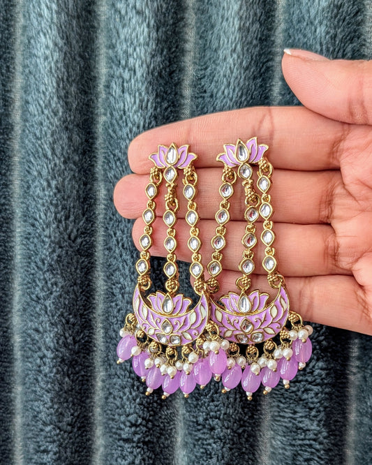 A pair of gold-colored chandbali earrings with meenakari work and lavender kundan stones. Available for pickup in Ajax, Ontario and worldwide shipping.