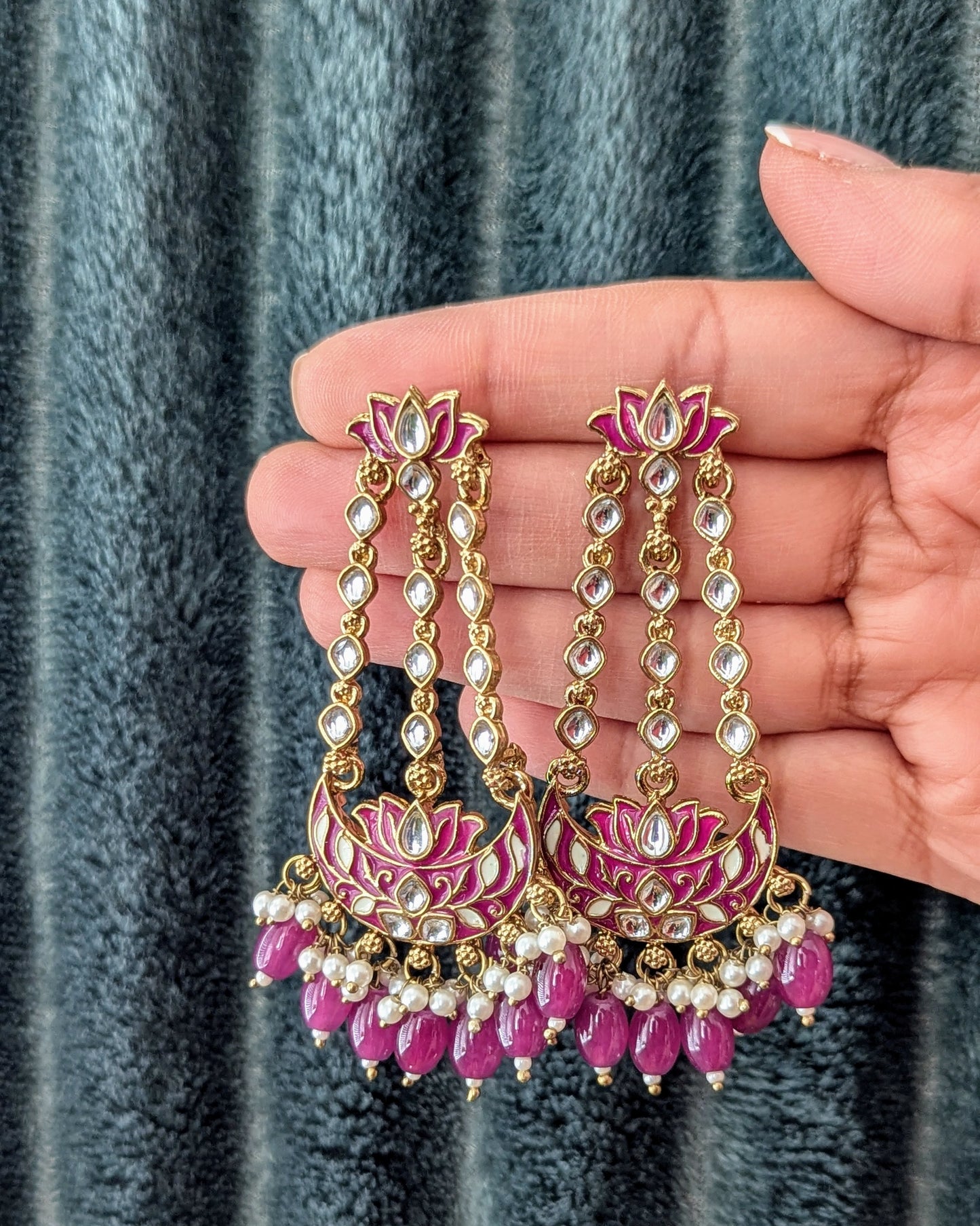 A pair of purple and gold statement chandbali earrings with meenakari work, kundan, and pearl embellishments. Available for pickup in Ajax, Ontario and worldwide shipping.