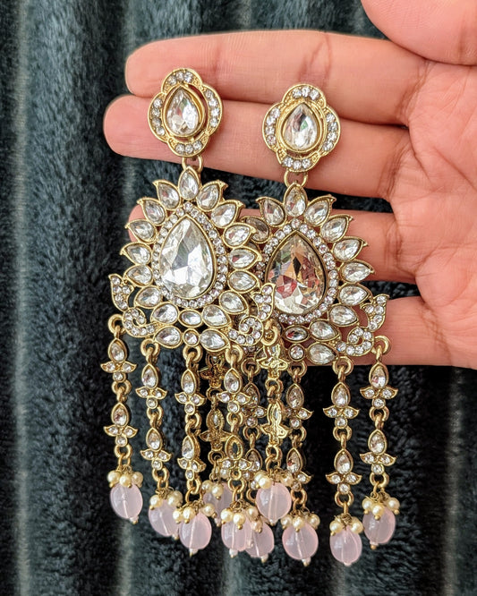 A pair of baby pink chandbali earrings with gold detailing and drop pearl accents. Available for pickup in Ajax, Ontario and worldwide shipping.