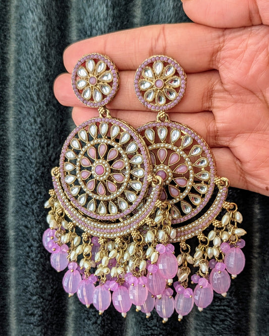 A pair of purple and silver chandbali earrings with intricate designs and pearl embellishments. Available for pickup in Ajax, Ontario and worldwide shipping.