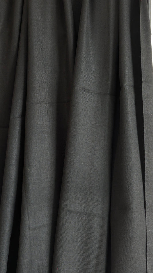 A classic plain black woolen lohi for men and women.