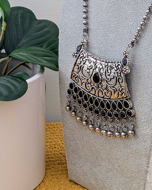 A long oxidized silver necklace with a statement pendant displayed on a mannequin bust. Pick-up in Ajax Ontario. Worldwide shipping available. Perfect for weddings, festival jewelry, indian Jewelry, kids jewelry, kundan jewelry, gifting, costume jewelry, fashion jewelry, Eid, onam, Diwali, karwachauth, navratri. Free shipping available. Jewelry for women. Indian jewelry in ajax toronto Canada