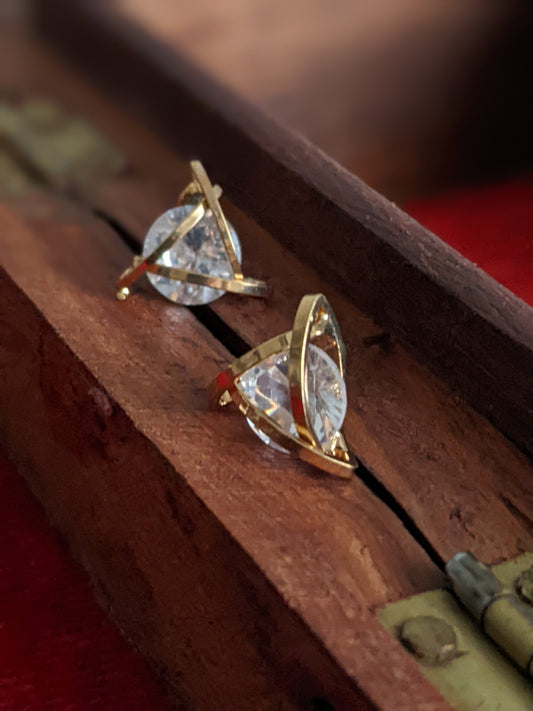 Small golden stud earrings with a modern design for everyday wear