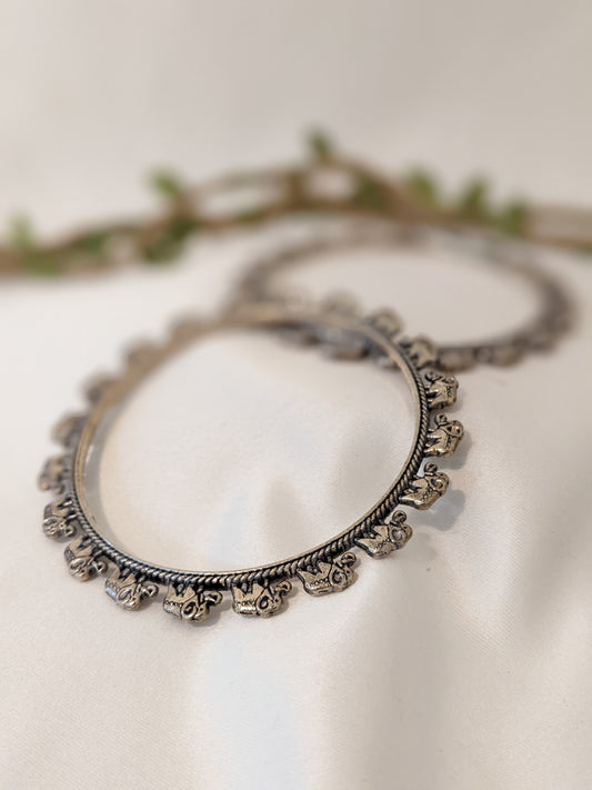 Oxidized silver bangles with baby elephant design. Comes in a pair of 2, size 2.6"