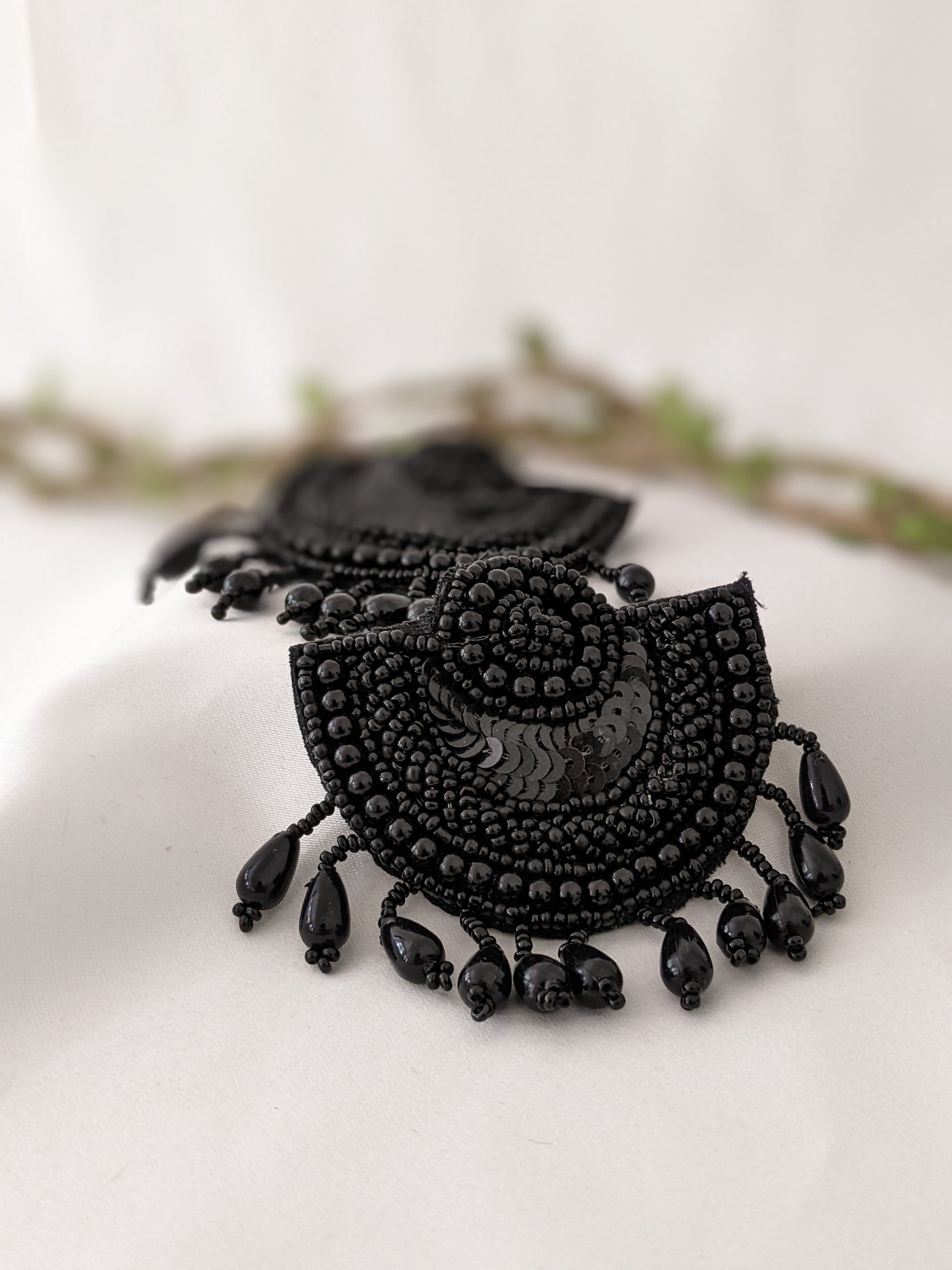 These feather weight earrings are perfect for a quirky look when you wanna give rest to your ears but still make a statement.   And by feather weight we mean the material used is fabric, so they are literally feather weight. Black earrings, black light weight earrings