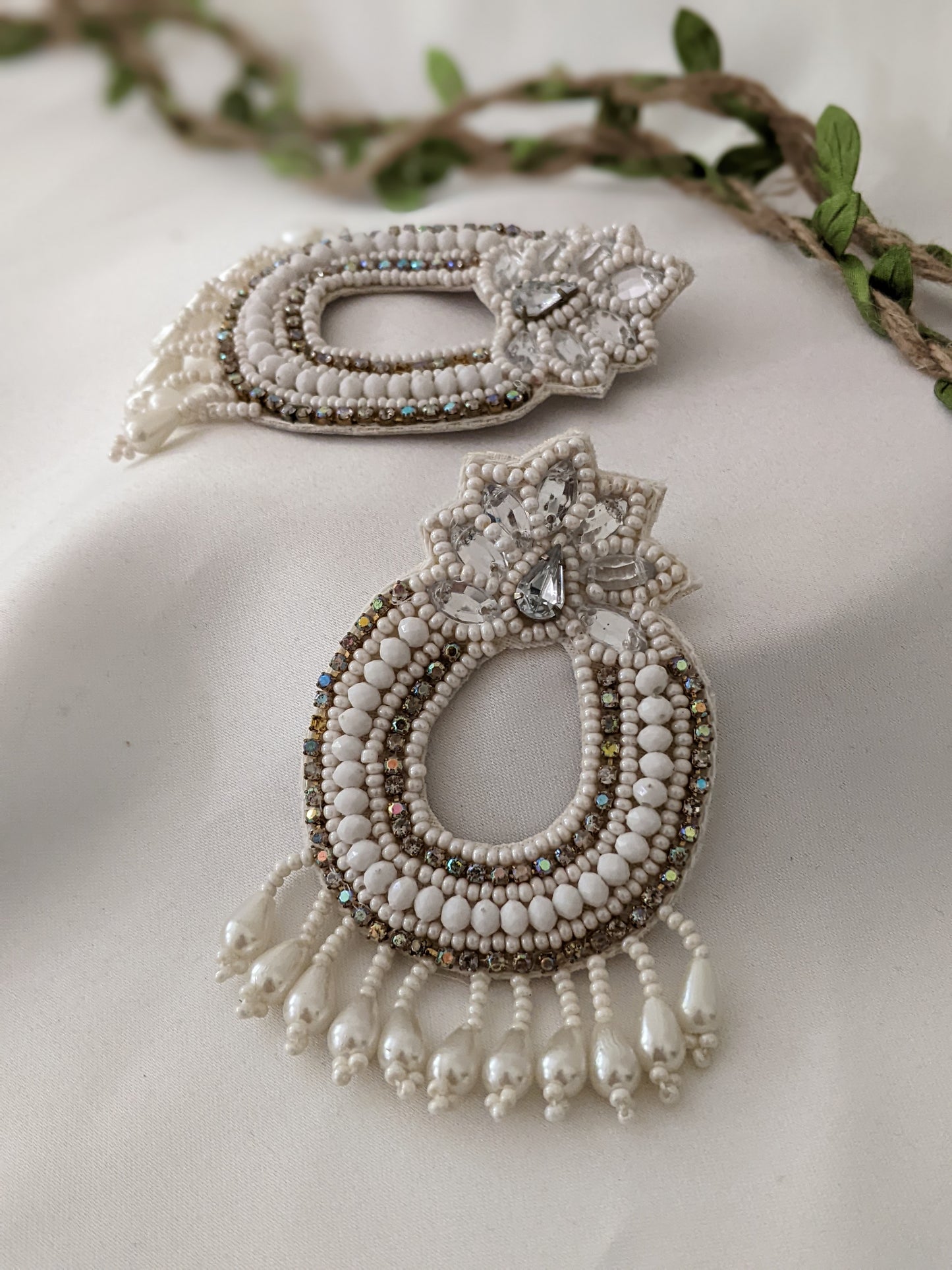 Bohemian fabric earrings in white & golden, these feather weight earrings are perfect for a quirky look when you wana give rest to your ears but still make a statement. And by feather weight we mean the material used is fabric, so they are literally feather weight