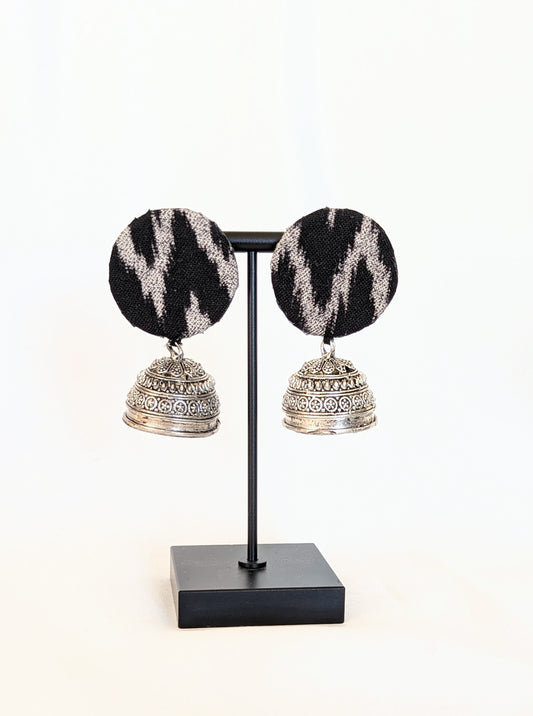 A pair of black ikat fabric earrings with a silver-colored hook and patterned design. Pick-up in Ajax Ontario. Worldwide shipping available. Perfect for wedding, festival jewelry, indian Jewelry, kids jewelry, kundan jewelry, gifting, costume jewelry, fashion jewelry, Eid, onam, Diwali, karwachauth, navratri. Free shipping available. Jewelry for women. Indian jewelry in ajax durham region.