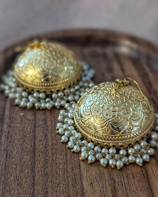 Gold earrings with intricate designs and pearl strands on a wooden tray. Pick-up in Ajax Ontario. Worldwide shipping available. Perfect for wedding, festival jewelry, indian Jewelry, kids jewelry, kundan jewelry, gifting, costume jewelry, fashion jewelry, Eid, onam, Diwali, karwachauth, navratri. Free shipping available. Jewelry for women. Indian jewelry in ajax durham region.