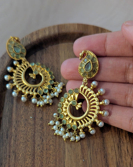 Gold earrings with pearls and green stone accents. Pick-up in Ajax Ontario. Worldwide shipping available. Perfect for wedding, festival jewelry, indian Jewelry, kids jewelry, kundan jewelry, gifting, costume jewelry, fashion jewelry, Eid, onam, Diwali, karwachauth, navratri. Free shipping available. Jewelry for women. Indian jewelry in ajax durham region.