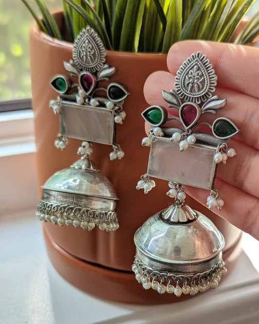 Silver earrings with intricate designs and red green stones. Pick-up in Ajax Ontario. Worldwide shipping available. Perfect for wedding, festival jewelry, indian Jewelry, kids jewelry, kundan jewelry, gifting, costume jewelry, fashion jewelry, Eid, onam, Diwali, karwachauth, navratri. Free shipping available. Jewelry for women. Indian jewelry in ajax durham region.