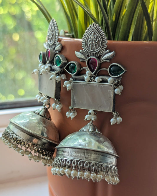 Silver earrings with intricate designs and red green stones. Pick-up in Ajax Ontario. Worldwide shipping available. Perfect for wedding, festival jewelry, indian Jewelry, kids jewelry, kundan jewelry, gifting, costume jewelry, fashion jewelry, Eid, onam, Diwali, karwachauth, navratri. Free shipping available. Jewelry for women. Indian jewelry in ajax durham region.