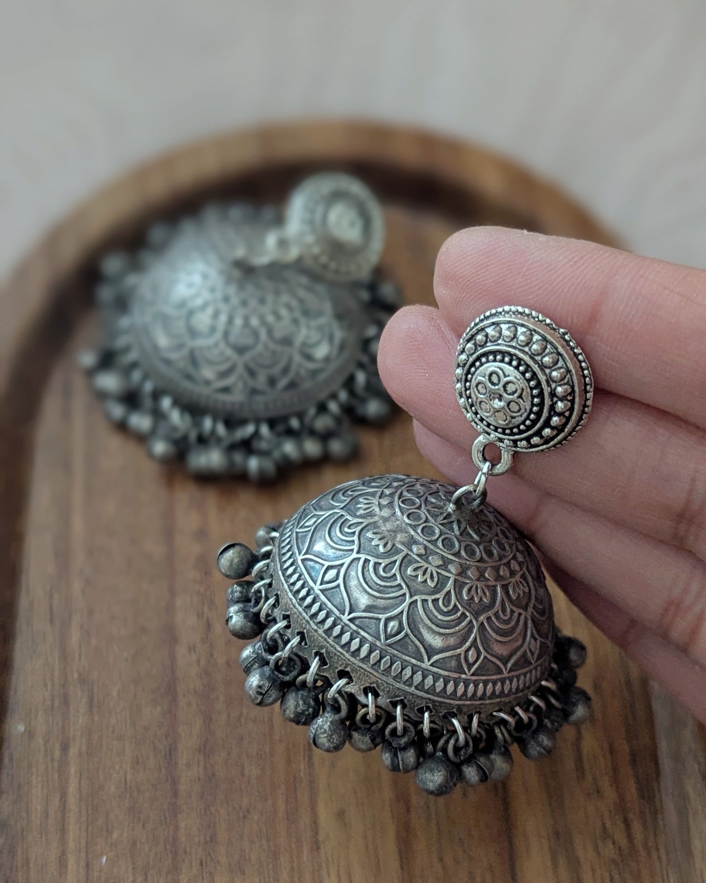 Pair of silver earrings with intricate design and ghungroos. Available for pickup in Ajax, Ontarion with worldwide shipping. Indian jewellery perfect for wedding, haldi, mehendi, diwali, Eid, karwachauth and festivals.