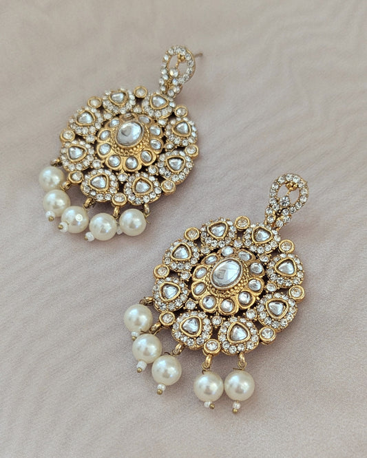 Premium Chandbali earrings in golden with stones and pearl detailing. Pick-up in Ajax Ontario. Worldwide shipping available. Perfect for wedding, festival jewelry, indian Jewelry, kids jewelry, kundan jewelry, gifting, costume jewelry, fashion jewelry, Eid, onam, Diwali, karwachauth, navratri. Free shipping available. Jewelry for women.