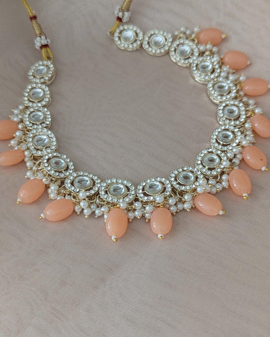 Dainty kundan necklace with peach color beads. Comes with matching drop earrings. Pick-up in Ajax Ontario. Worldwide shipping available. Perfect for wedding, festival jewelry, indian Jewelry, kids jewelry, kundan jewelry, gifting, costume jewelry, fashion jewelry, Eid, onam, Diwali, karwachauth, navratri. Free shipping available. Jewelry for women.
