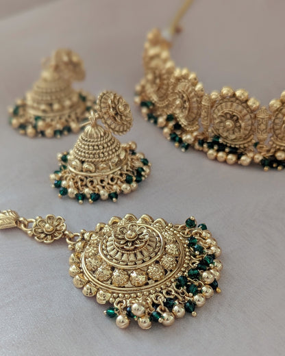 Statement gold plated necklace in golden with green pearls. Comes with matching jhumka earrings and a statement tikka. Pick-up in Ajax Ontario. Worldwide shipping available. Perfect for wedding, festival jewelry, indian Jewelry, kids jewelry, kundan jewelry, gifting, costume jewelry, fashion jewelry, Eid, onam, Diwali, karwachauth, navratri. Free shipping available. Jewelry for women.