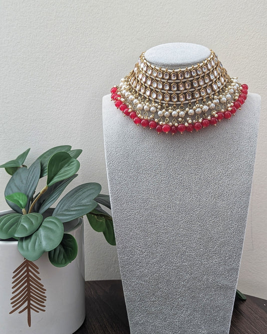 Statement Kundan choker/chokar necklace with dark pink beads and pearl detailing. Comes with matching jhumka earrings and tikka. Pick-up in Ajax Ontario. Worldwide shipping available. Perfect for wedding, festival jewelry, indian Jewelry, kids jewelry, kundan jewelry, gifting, costume jewelry, fashion jewelry, Eid, onam, Diwali, karwachauth, navratri. Free shipping available. Jewelry for women.