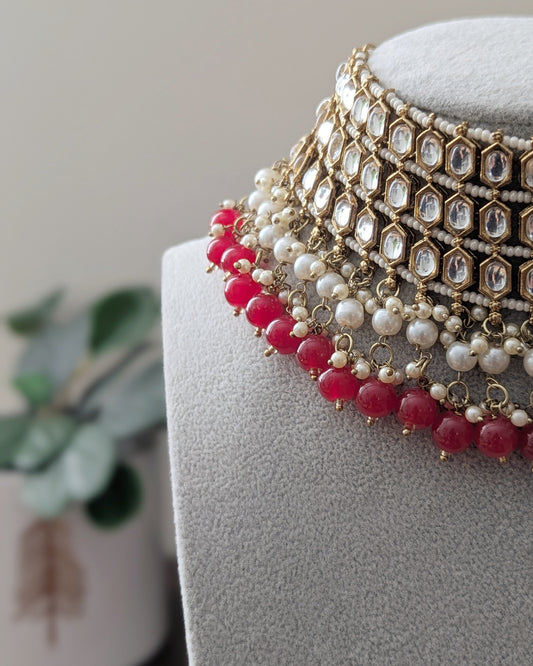 Statement Kundan choker/chokar necklace with dark pink beads and pearl detailing. Comes with matching jhumka earrings and tikka. Pick-up in Ajax Ontario. Worldwide shipping available. Perfect for wedding, festival jewelry, indian Jewelry, kids jewelry, kundan jewelry, gifting, costume jewelry, fashion jewelry, Eid, onam, Diwali, karwachauth, navratri. Free shipping available. Jewelry for women.