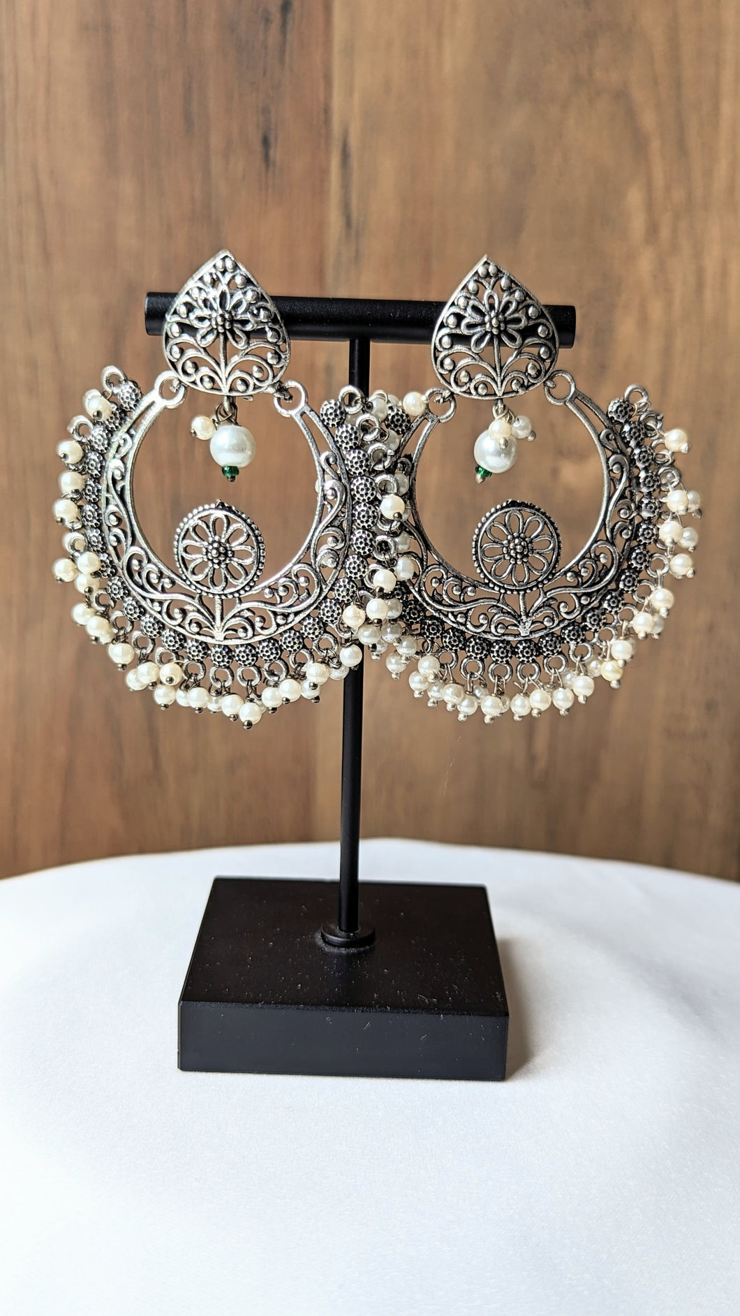 Classic chaandbalis in oxidized silver with pearl detailing.