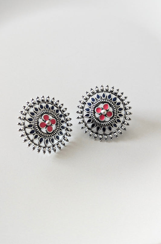 A pair of oxidized silver stud earrings with blue and red embellishments. Pick-up in Ajax Ontario. Worldwide shipping available. Perfect for wedding, festival jewelry, indian Jewelry, kids jewelry, kundan jewelry, gifting, costume jewelry, fashion jewelry, Eid, onam, Diwali, karwachauth, navratri. Free shipping available. Jewelry for women. Indian jewelry in ajax durham region.