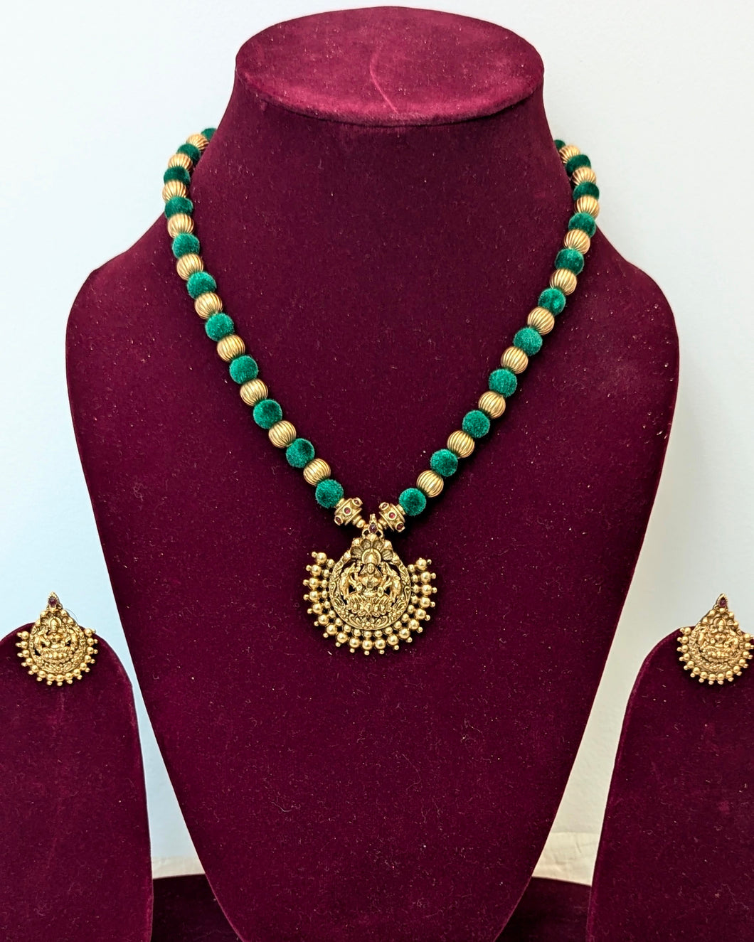 Temple jewelry. Medium length green silk threads necklace with laxmi/lakshmi pendant and earrings.