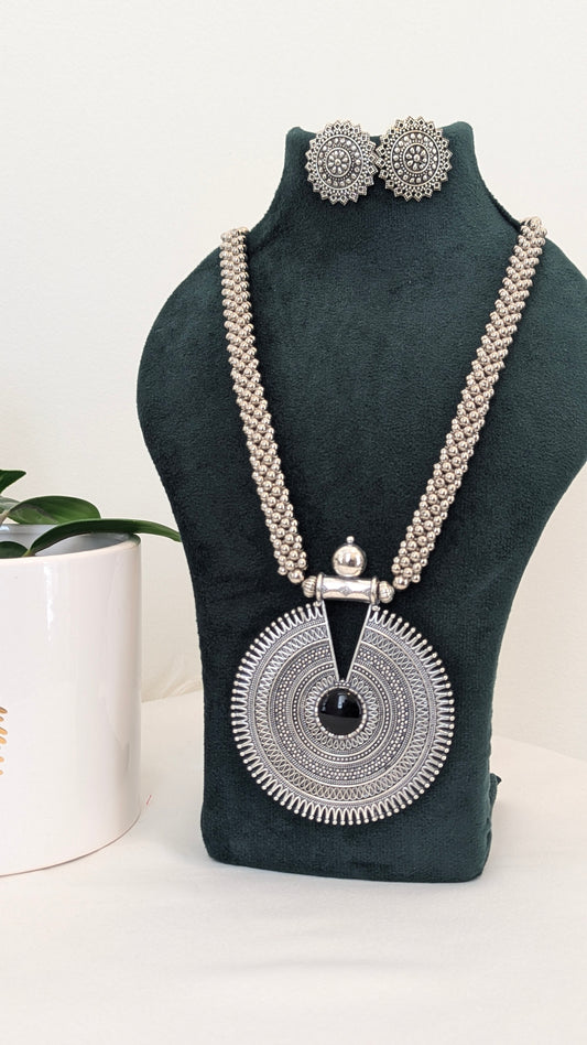 Oxidized silver long necklace with statement pendant design, comes with matching earrings.