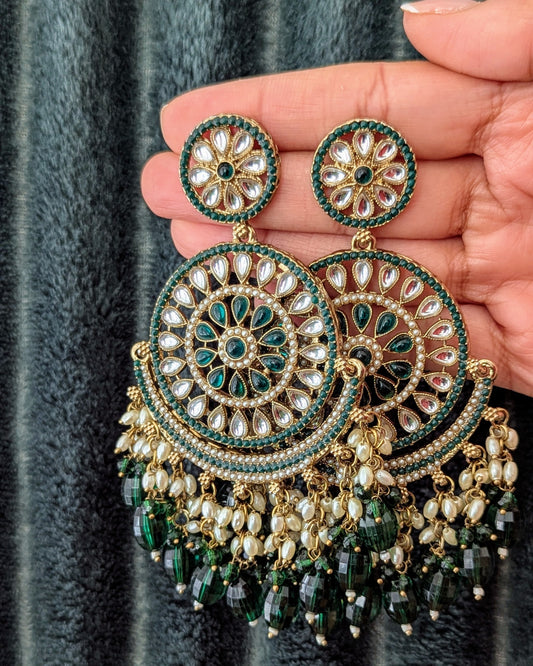 A pair of dark green and gold-colored chandbali earrings with intricate patterns and pearl-like drops. Available for pickup in Ajax, Ontario and worldwide shipping.