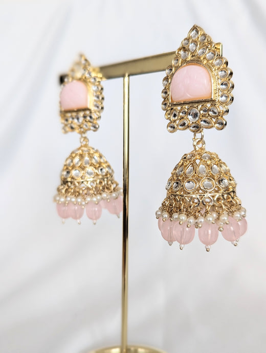 Adorn yourself with the radiant Bhavna Jhumka in pink! This exquisite kundan crafted piece is sure to leave you feeling glamorous and gorgeous. Available in yellow as well!