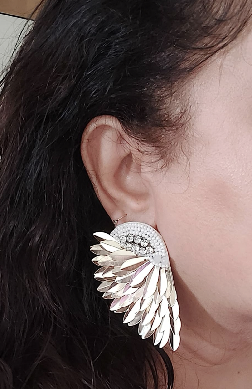 Uniquely designed fabric earrings in shape of angel wings. Very light weight earrings with a modern design