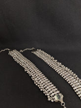 Load image into Gallery viewer, These silver anklets have a heavy look and are full with ghungroos. Your presence surely won&#39;t get unnoticed when wearing these
