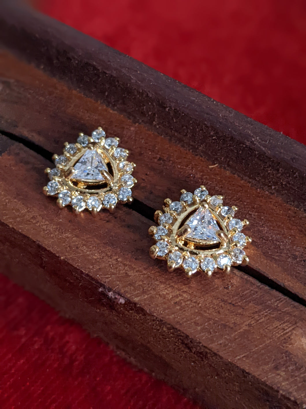Small stud earrings for a classy look. Wear it with ethnic or modern clothes