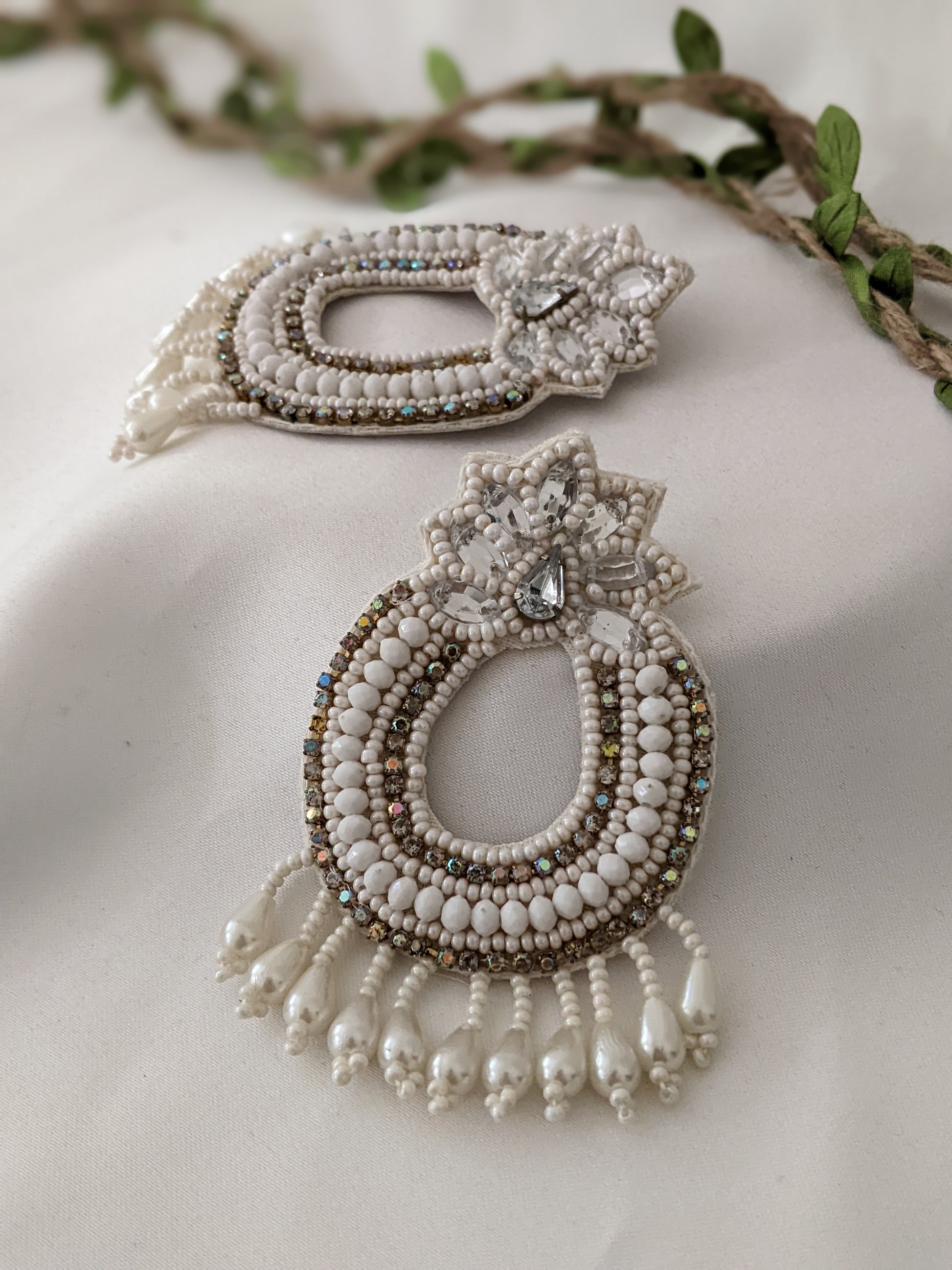 Bohemian fabric earrings in white & golden, these feather weight earrings are perfect for a quirky look when you wana give rest to your ears but still make a statement.   And by feather weight we mean the material used is fabric, so they are literally feather weight